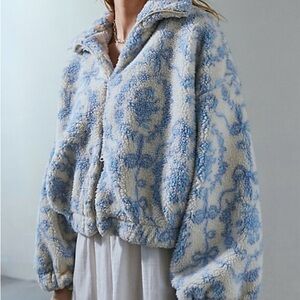 Urban Outfitters
"Kimchi Blue Snow Bunny Printed Piled
Fleece Zip-Up Jacket"